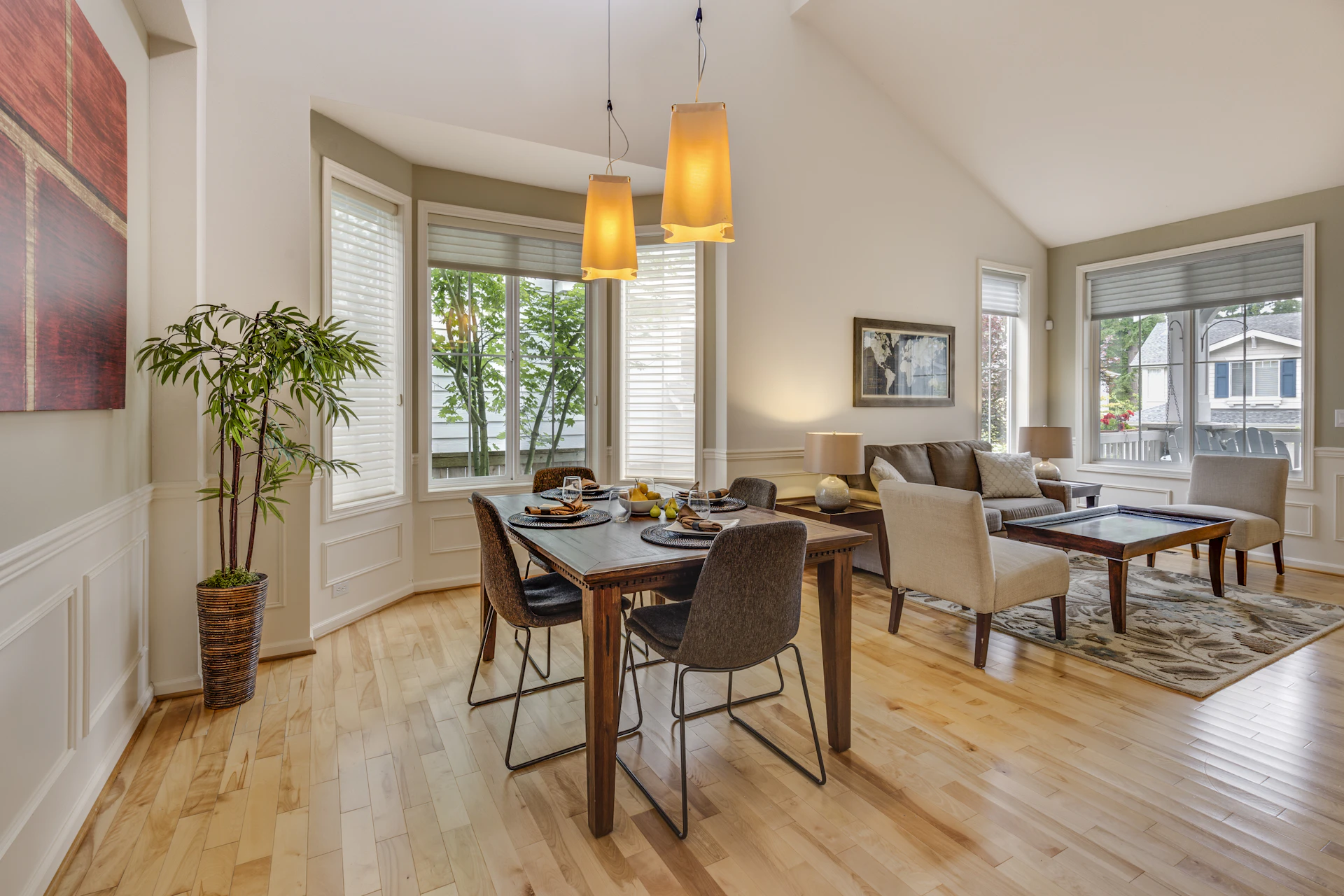 Warm residential dining and living space with wooden furniture