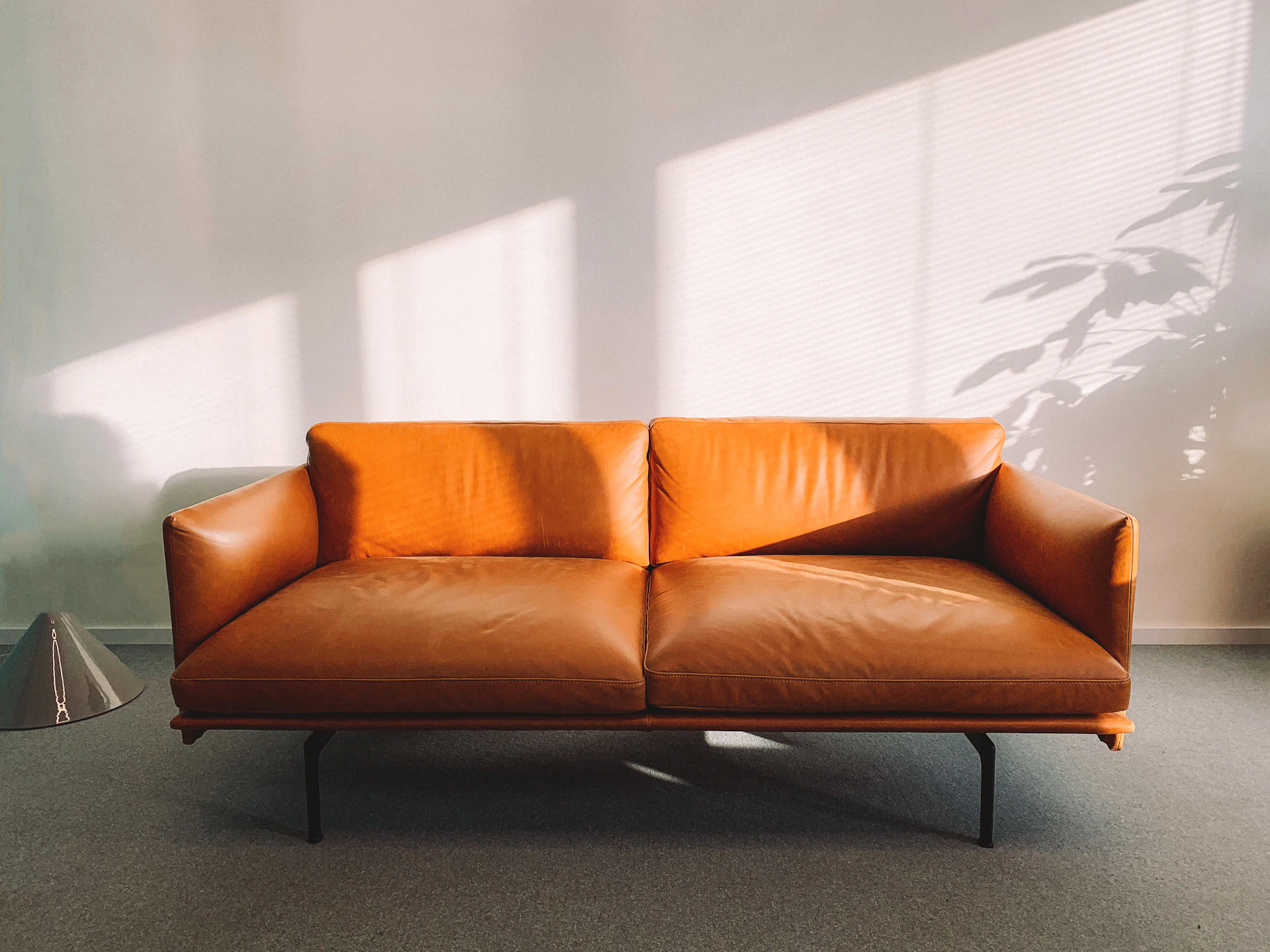 Custom caramel leather sofa in a warm living space