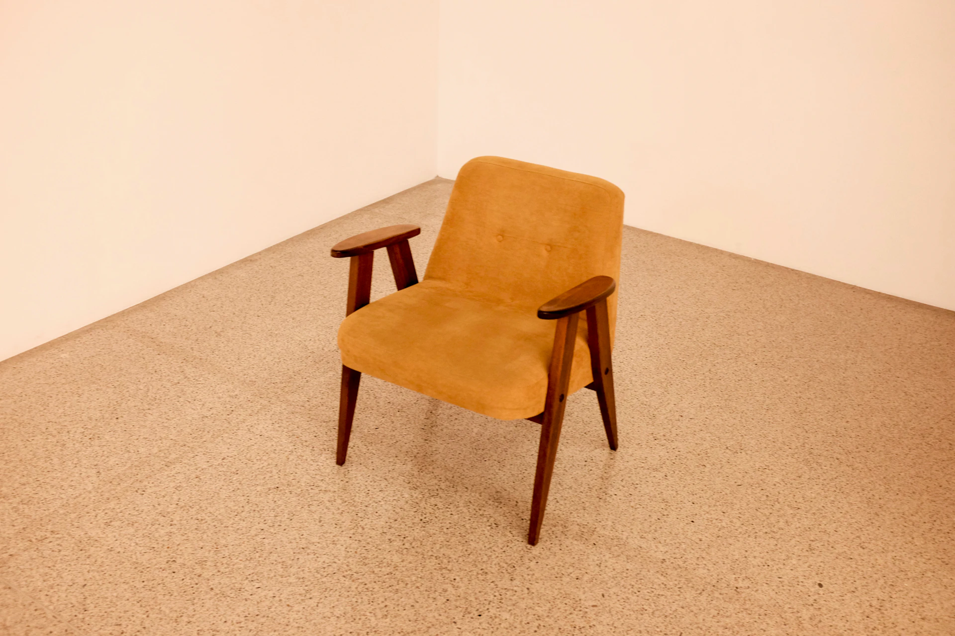 Caramel-toned wood-framed armchair