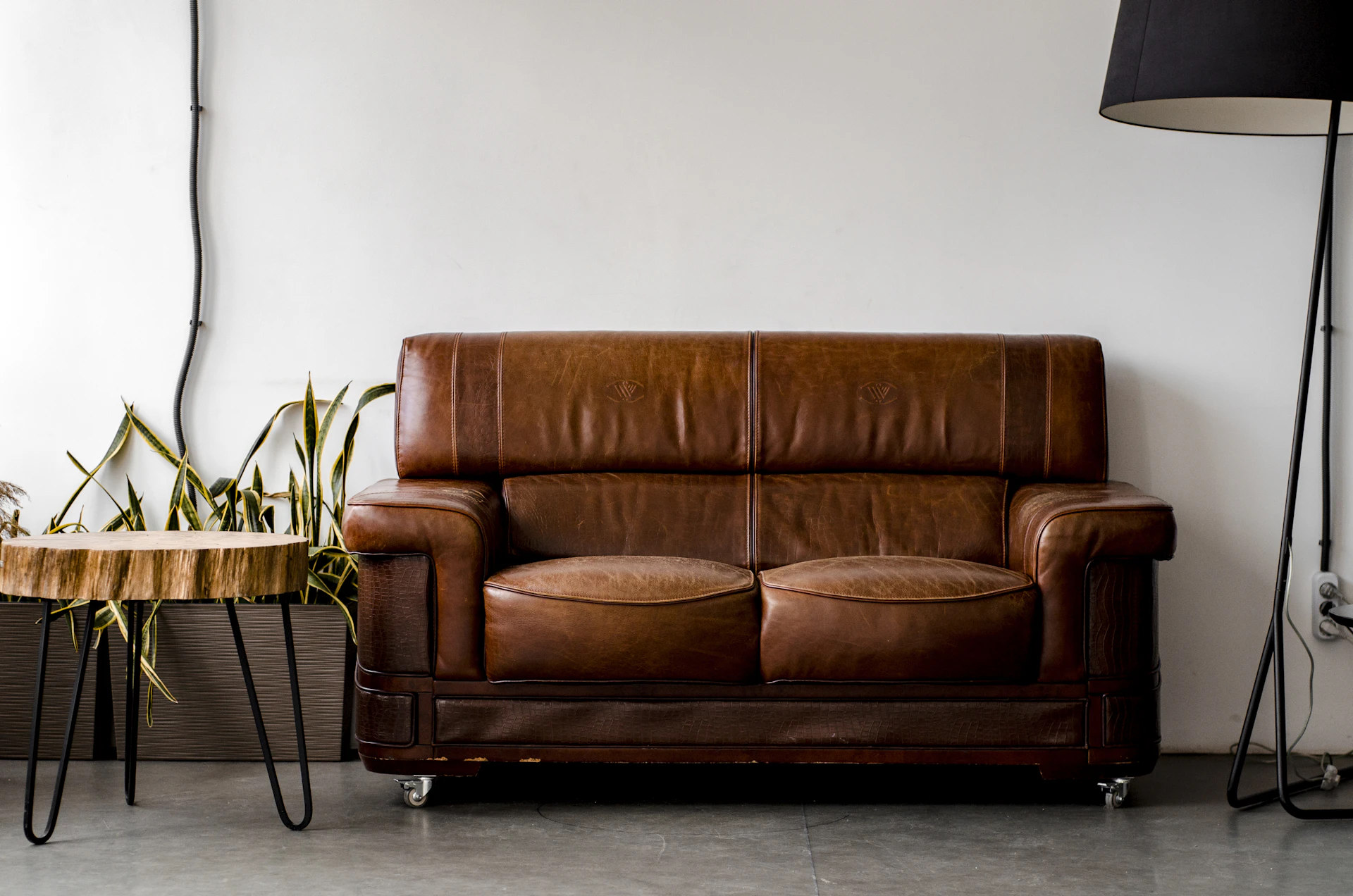 Vintage-style upholstered brown leather sofa