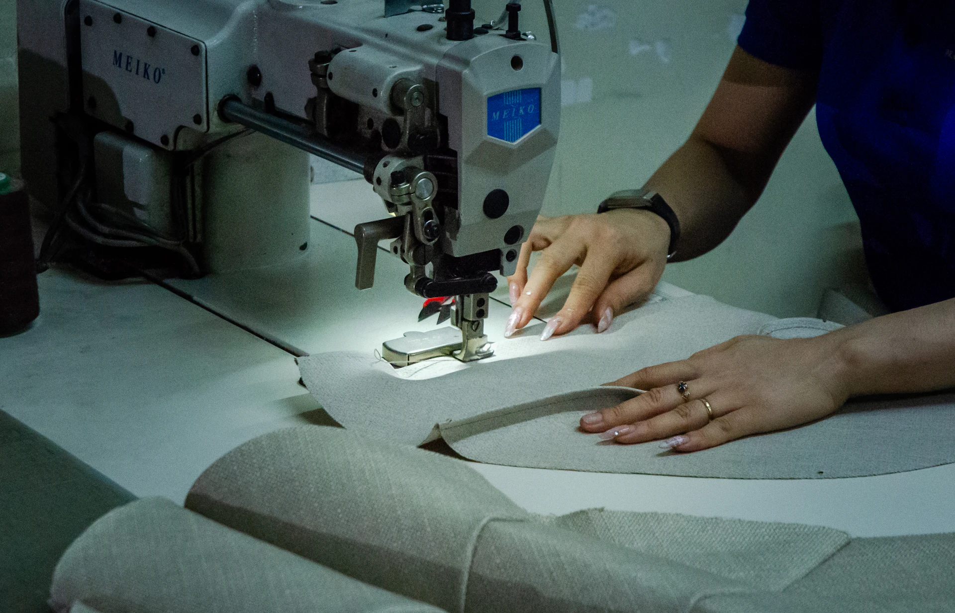 Upholstery in progress — stitching fabric on an industrial sewing machine